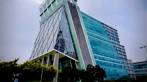 Contemporary green glass skyscraper with unique architecture