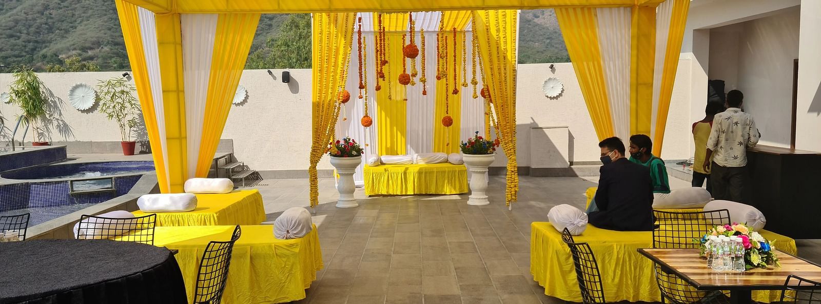 Outdoor tent with tables and chairs.