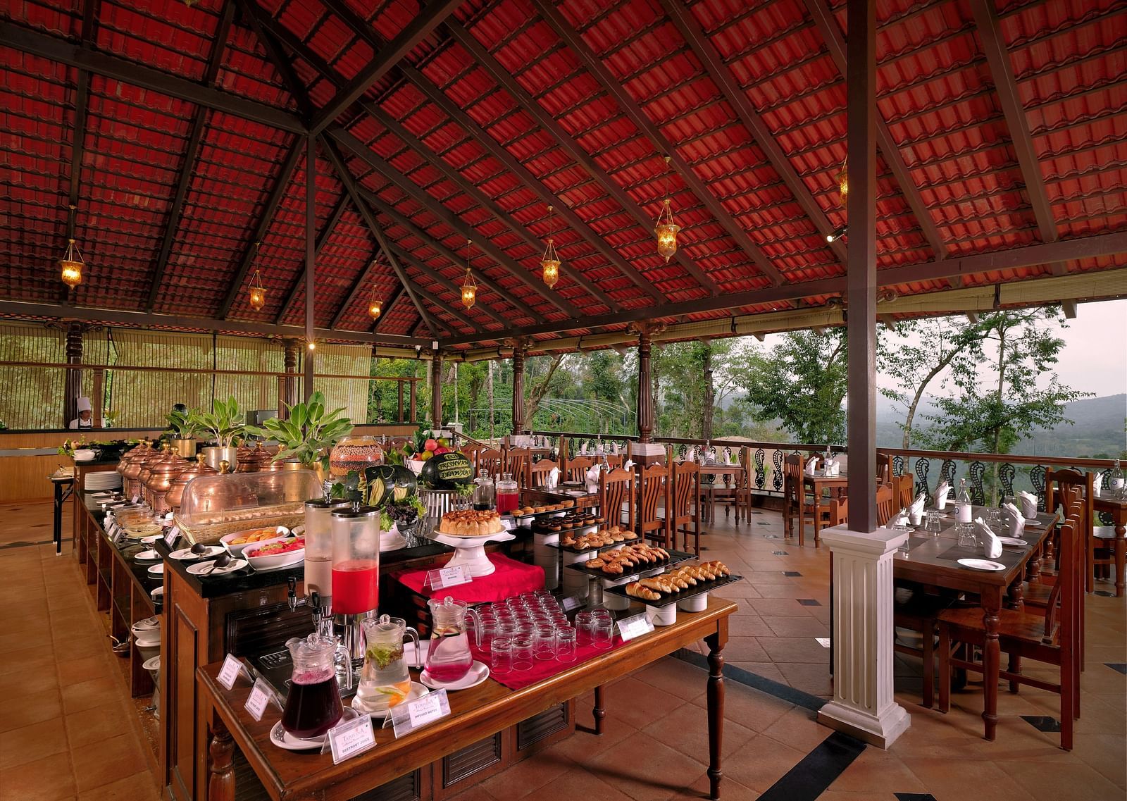 An open air restaurant image with comfortable seating and bright lights