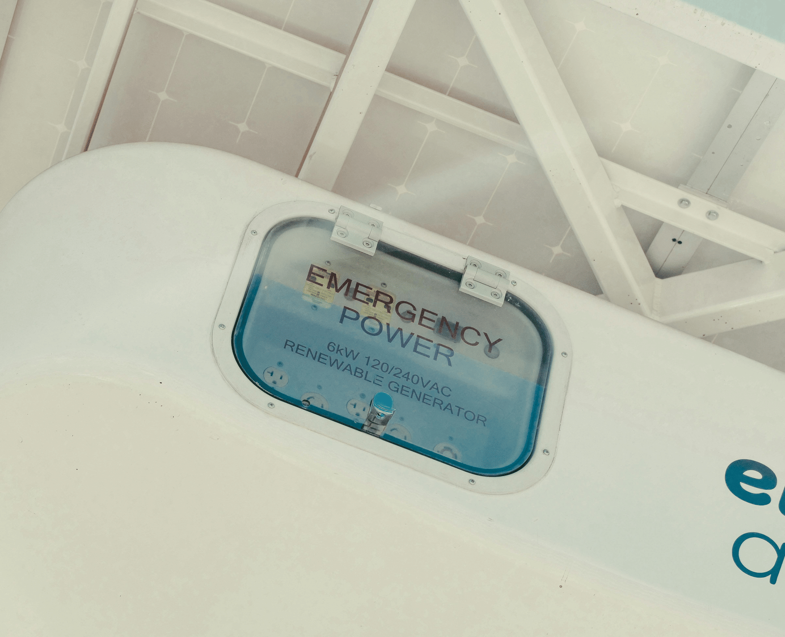 A huge white renewable generator saying 'EMERGENCY POWER'.