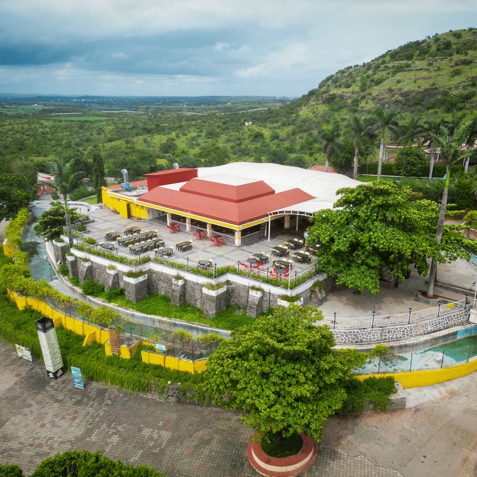 An aerial view of Diamond Parks, Pune with greenery surrounding it.