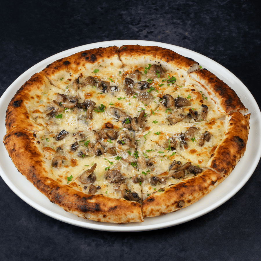 Pizza slices placed on a plate at The Wild Fork restaurant in La Marvella, Bengaluru. 