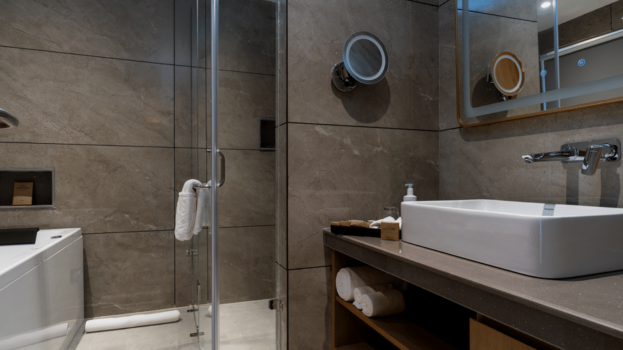 Contemporary bathroom at Mountnoor Sarovar Premiere, Pahalgam with premium fittings and stylish interiors.