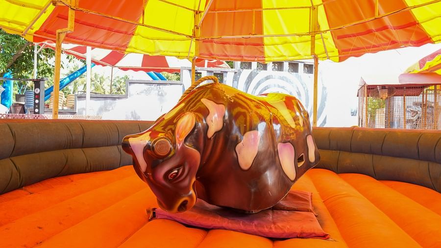 A bull ride at MGM Dizzee World where people sit and the bull rotates on a cushion bed. 