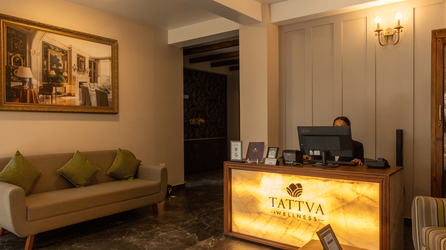 Wellness space at Heritage Club with a person standing near the reception desk.