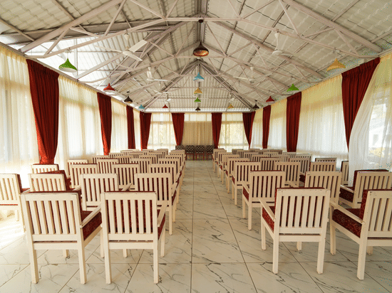 Picture of the banquet hall with the chairs arranged for an event.