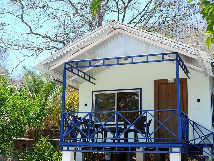 image of the facade of a cottage in Yelagiri with steps leading up to the cottage door - MGM Whispering Wind's, Yelagiri
