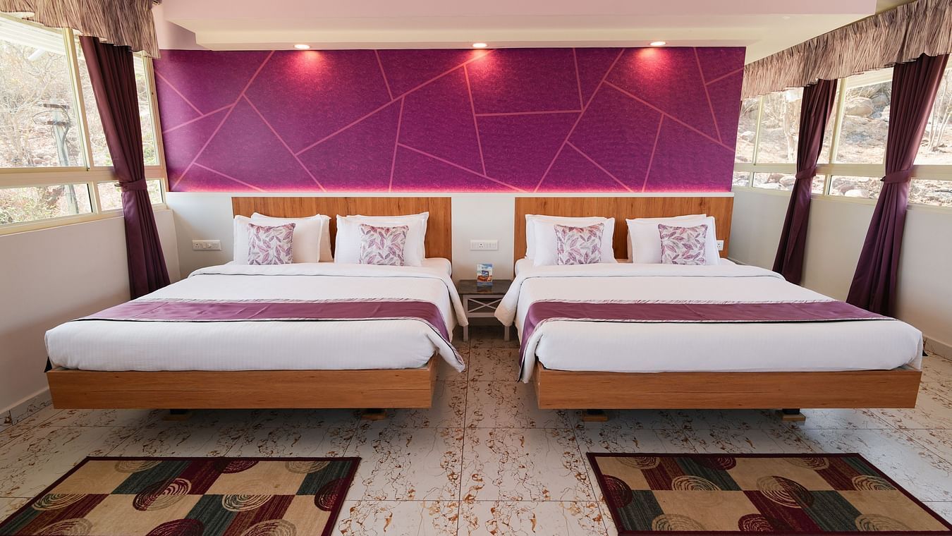 a bedroom with two king size beds side by side - MGM Whispering Wind's, Yelagiri