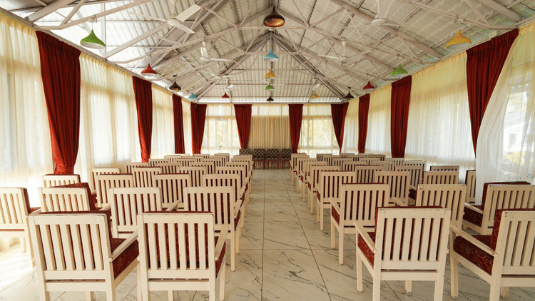 Picture of the banquet hall with the chairs arranged for an event.