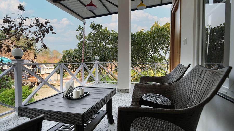 A private balcony overlooking a beautiful garden - MGM Whispering Wind's Resorts