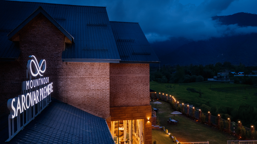 Rooftop view of Mountnoor Sarovar Premiere, Pahalgam showcasing elegant architecture and panoramic valley scenery.