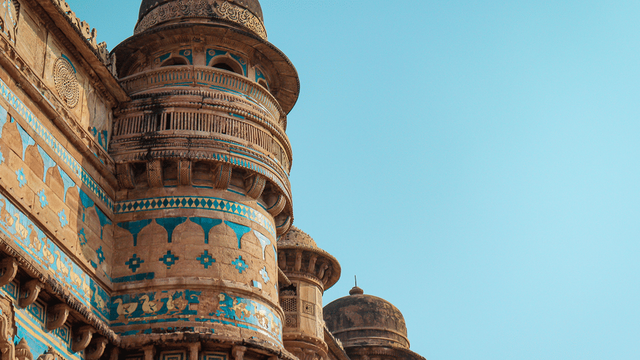 Man Mandir Palace within the Gwalior Fort featuring the outer vibrant architecture under a clear sky