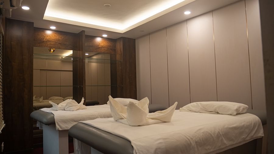 Spacious twin spa beds at Mansha Regency, Port Blair, with warm lighting and soothing ambience.