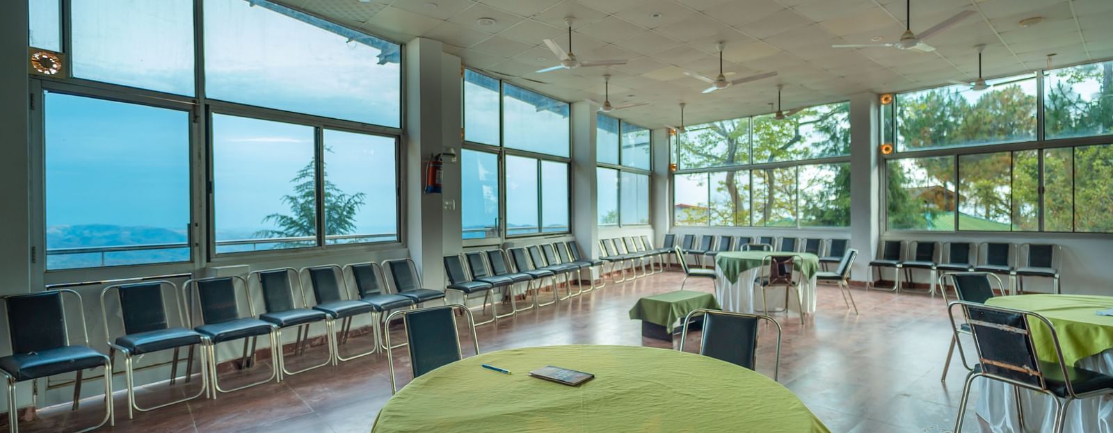 round tables placed in the event venue at Flutter Hotels & Resorts