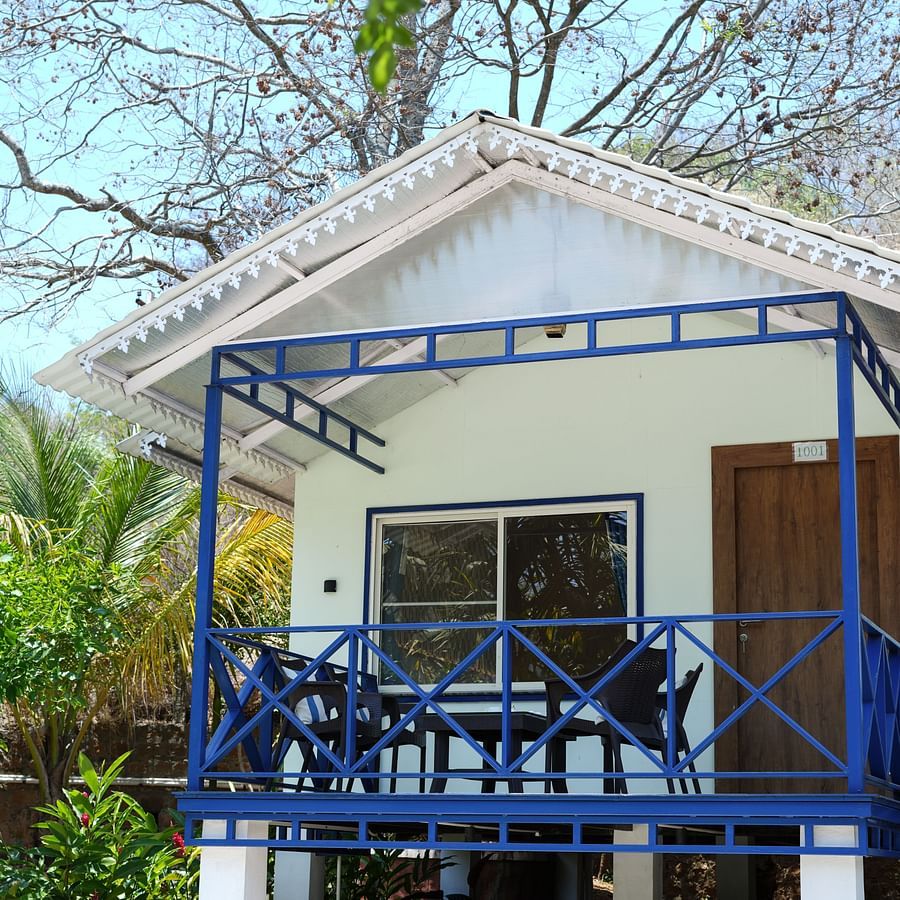 image of the facade of a cottage in Yelagiri with steps leading up to the cottage door - MGM Whispering Wind's, Yelagiri