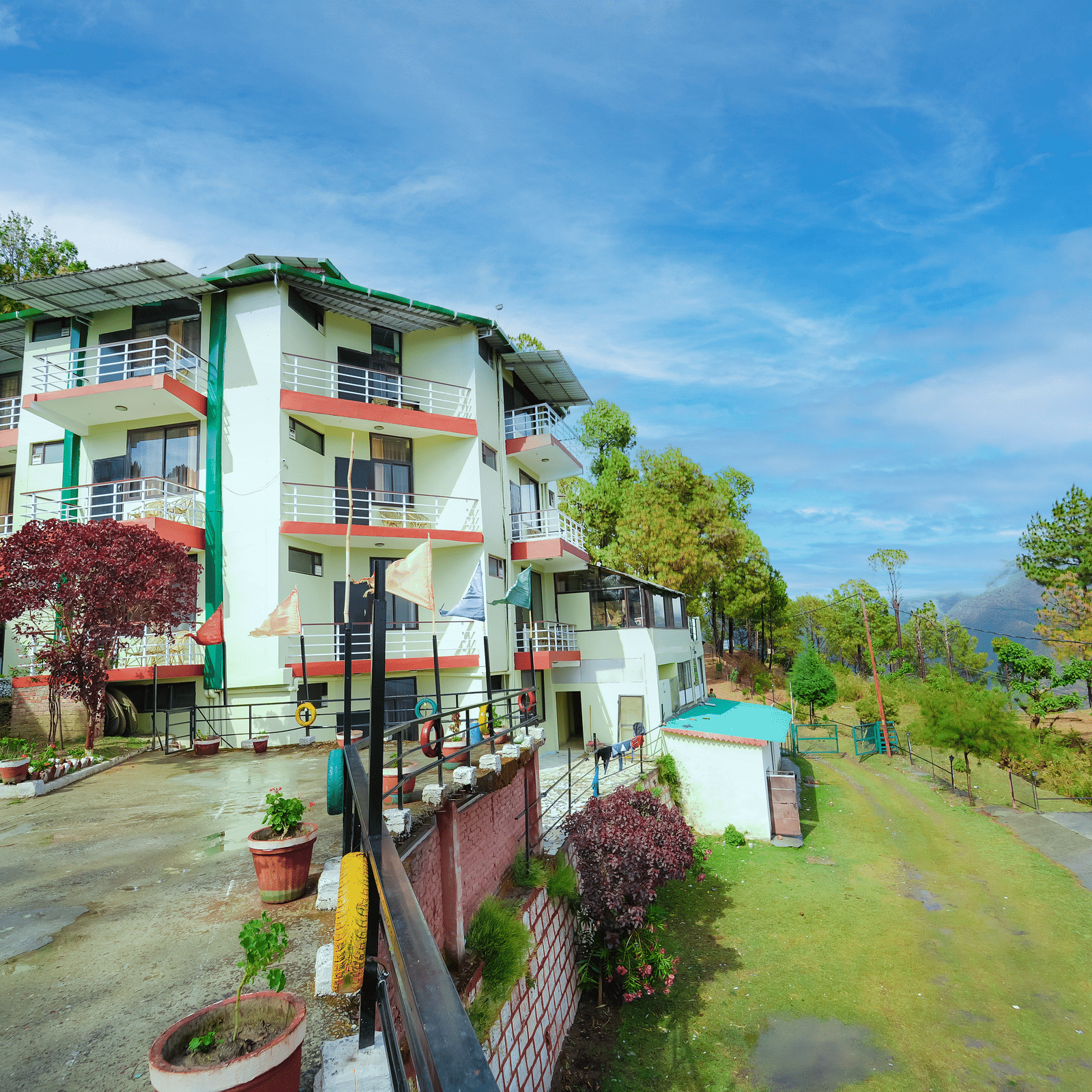 exterior of Flutter Hotels & Resorts surrounded by trees