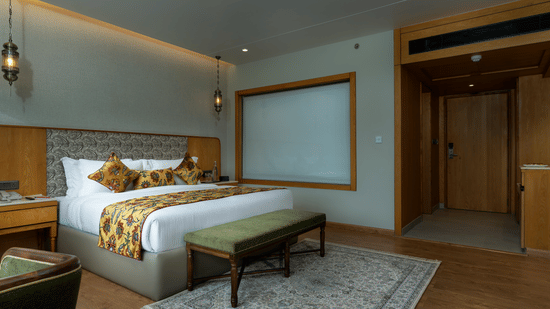 Elegant bedroom interior at Mountnoor Sarovar Premiere, Pahalgam designed for comfort and relaxation.