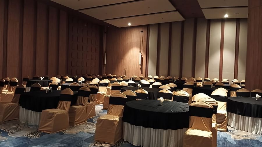 Banquet Hall with chairs surrounding the tables at Ramada Encore, Bhiwadi.