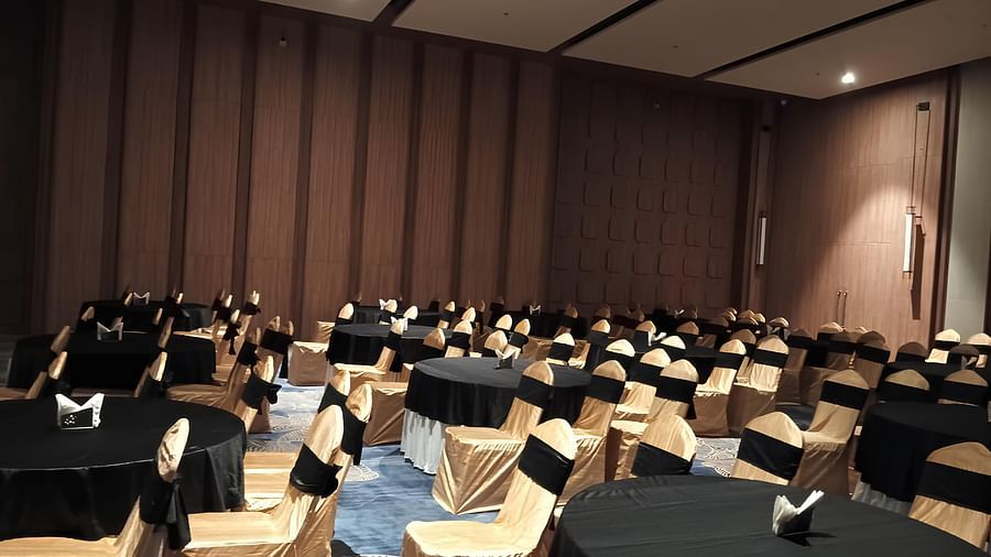 Banquet Hall with chairs surrounding the tables at Ramada Encore, Bhiwadi.