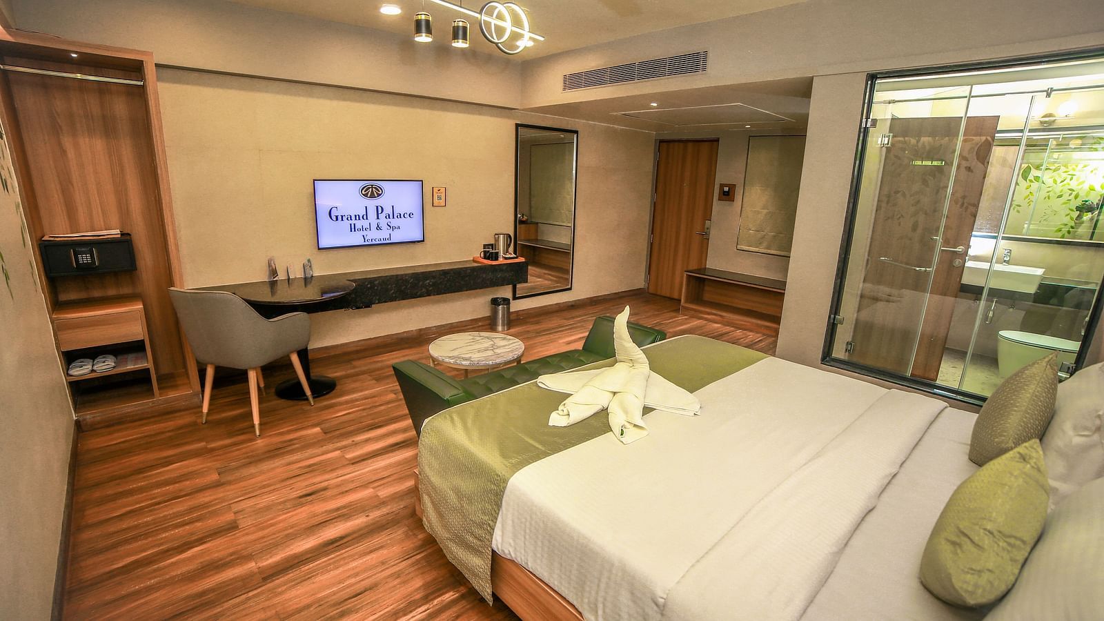 Side view of the double bed in the Standard Room at Grand Palace, Yercaud