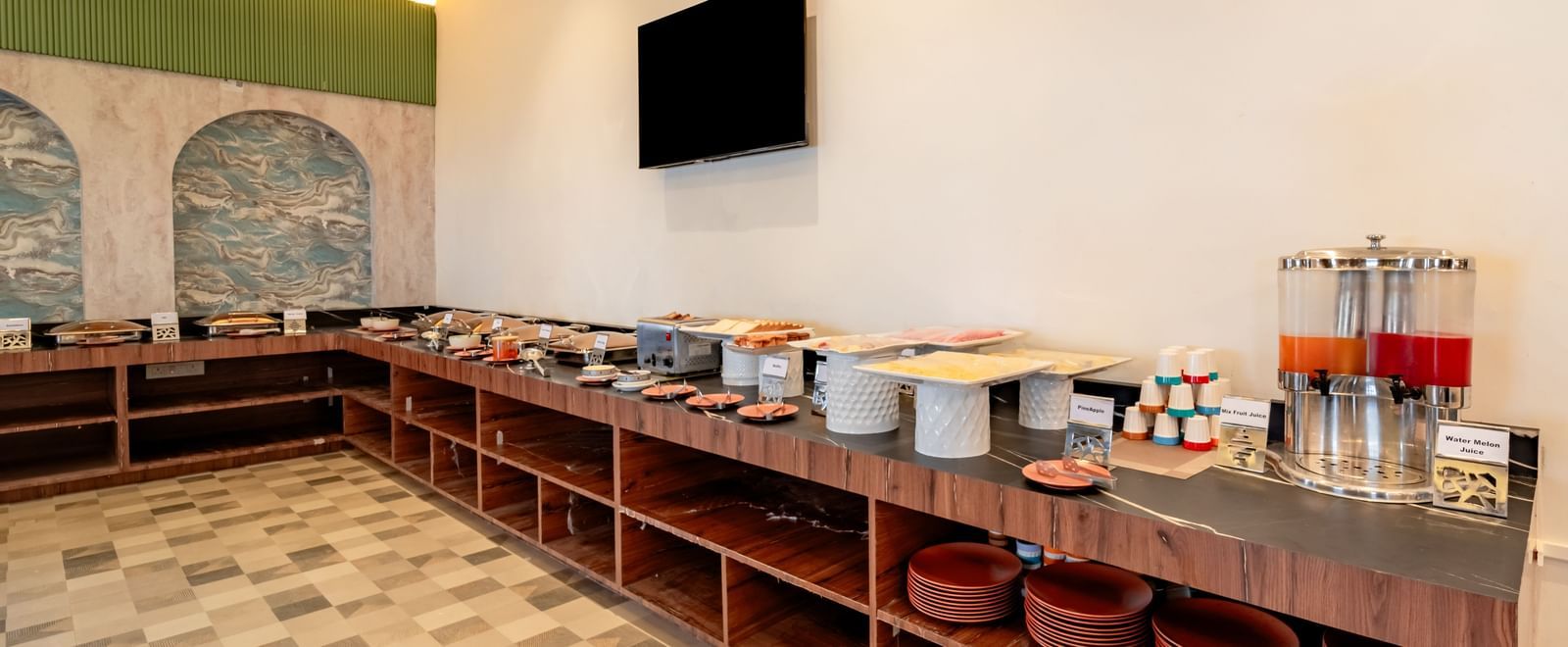 Buffet spread with various hot food options in chafing dishes | Pravasa Hotel, Vijayapura