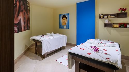 Interior of Sohum Spa at The Pride Premier Nagpur featuring two spa beds with flower petals on them