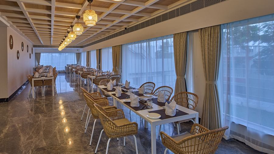 tables and bamboo chairs in the dining outlet at Grand Continent, Mahabalipuram