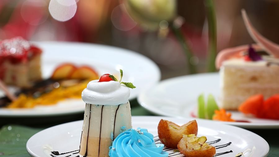 Desserts served on a plate with a cherry on the top at Uday Backwater Resort