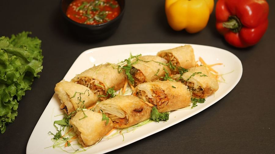 An image of spring rolls served in a platter at the restaurant of Five Elements Hotels North Avenue, Delhi