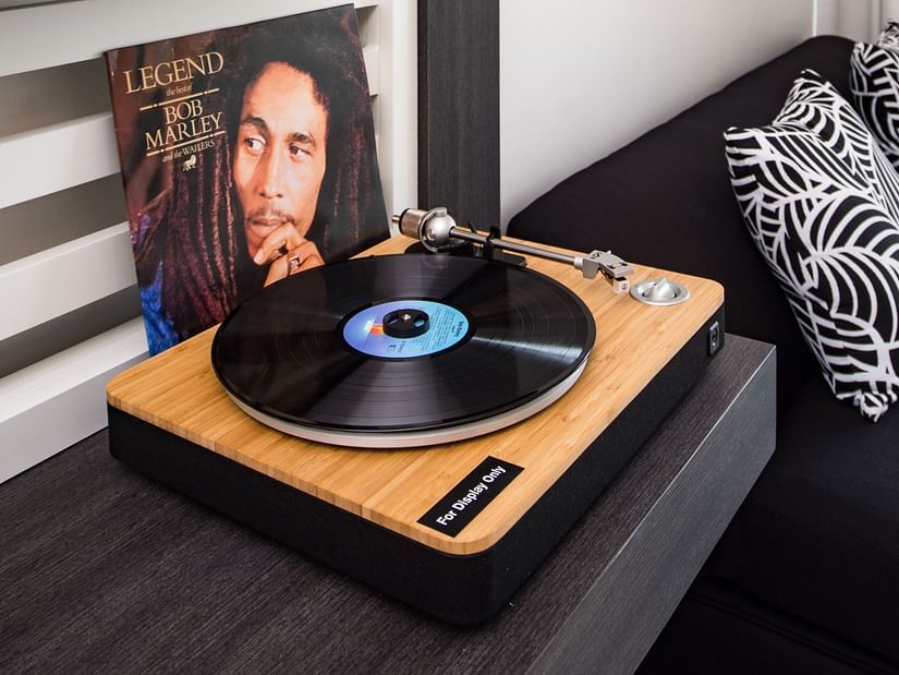 A vintage CD player with an album cover of BOB Marley placed behind it - S Hotel Montego Bay, Jamaica