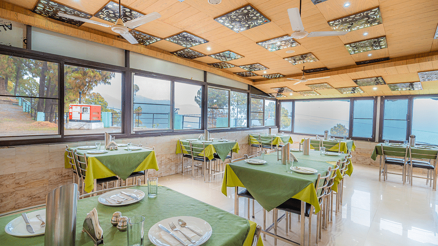 a restaurant at Flutter Hotels & Resorts offering a view of the valley