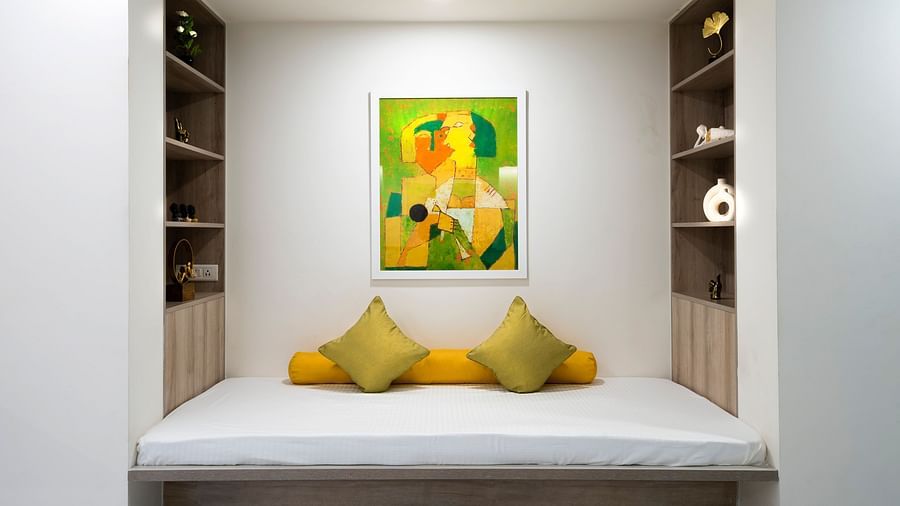 Seating corner with a wall painting in Studio Premium Room at Nest by Rivido Apart Hotel, Bannerghatta Road