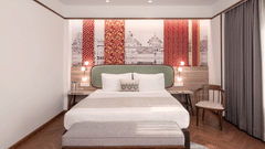 A comfortable hotel bedroom with a bed and a seating area.