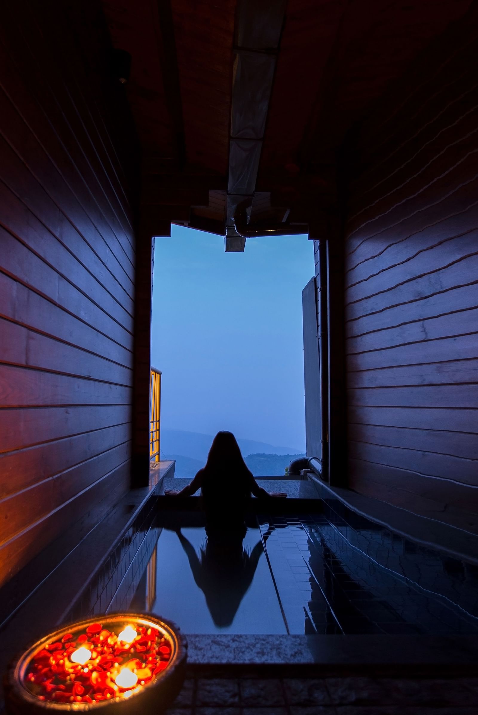 Guest relaxing inside a private plunge pool with a valley view at Polo Resort Cherrapunjee.