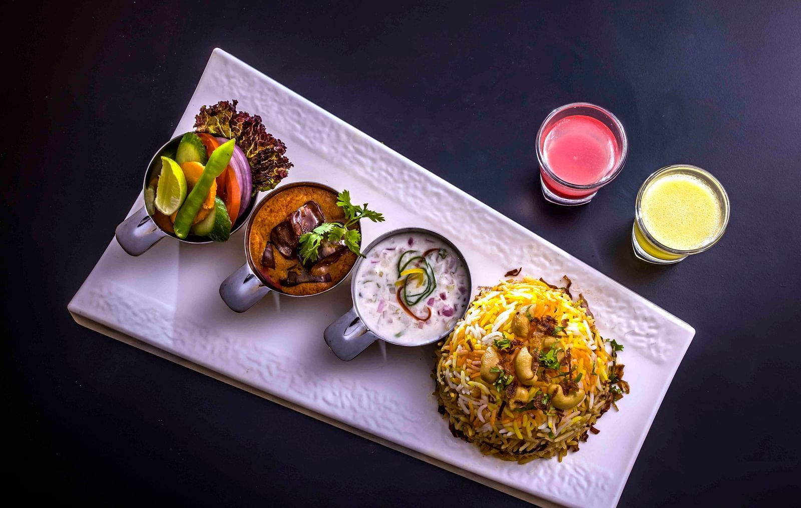 Image of a plate filled with food kept on the table.
