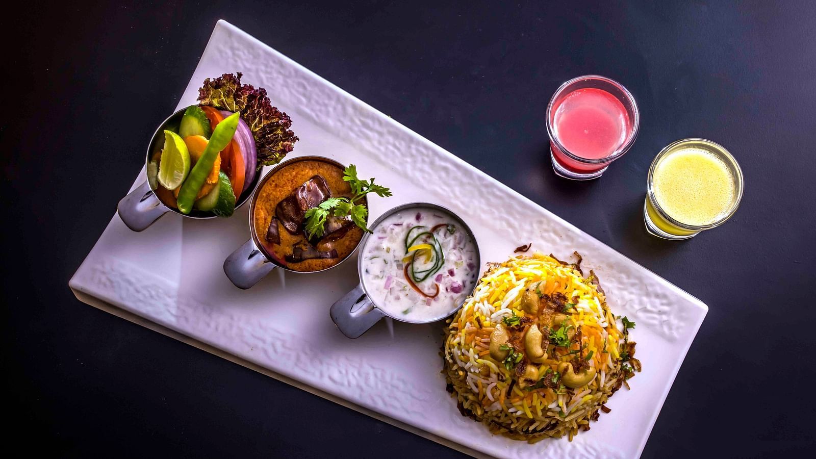 Image of a plate filled with food kept on the table.