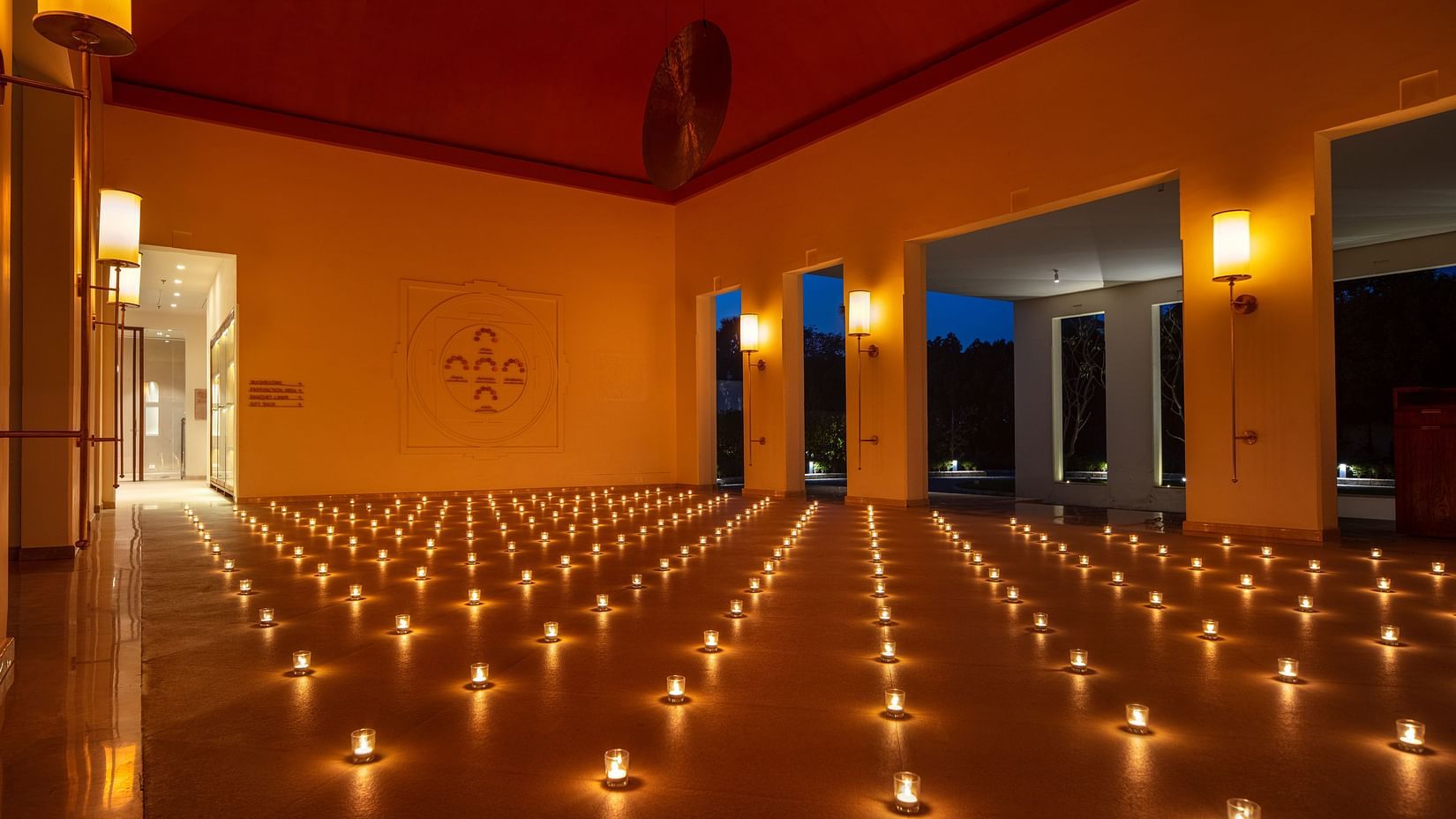 A room with dim lighting can candles lit up all around.