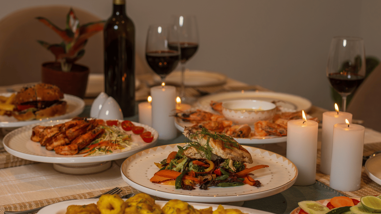 Gourmet dinner spread with wine and candlelight – Lamrin Morjim Goa