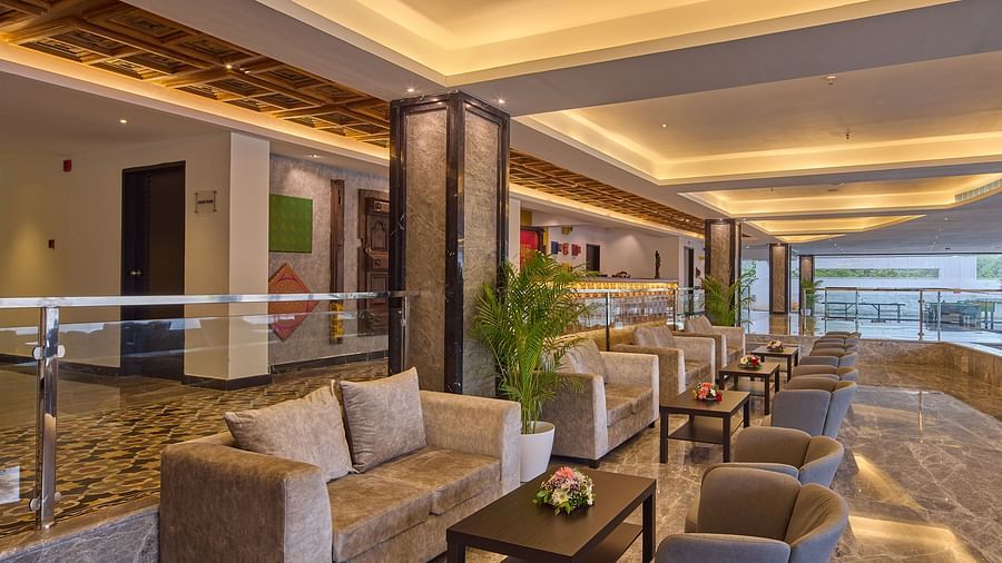 sofas, armchairs, and coffee tables in the lobby of our hotel in mahabalipuram - Grand Continent, Mahabalipuram