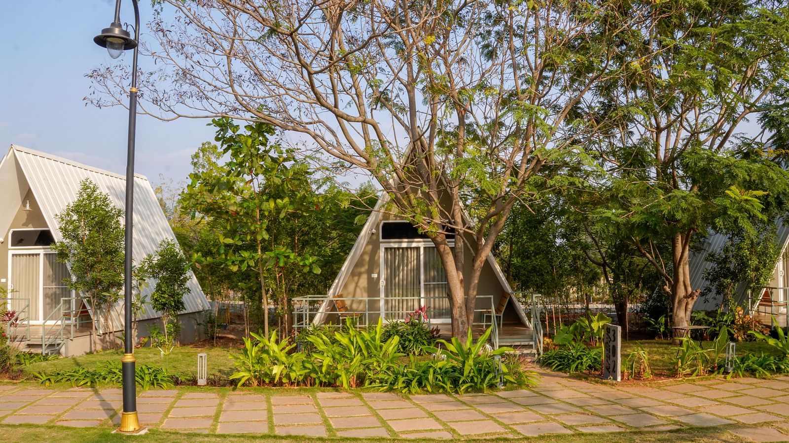 Exterior ViewA facade image of the Aradhya cottage with greenery around - Trance Veechika Resort