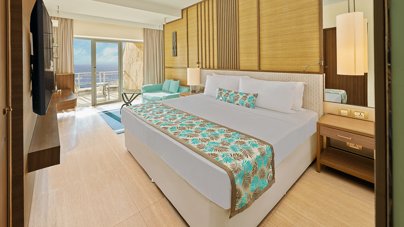 A side view of a bedroom with a bed | The Resort