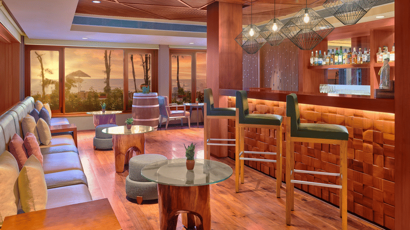 A seaside bar with comfortable seating and great ambience at The Resort, Mumbai