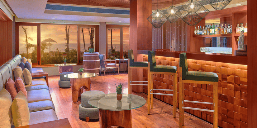 A seaside bar with comfortable seating and great ambience at The Resort, Mumbai
