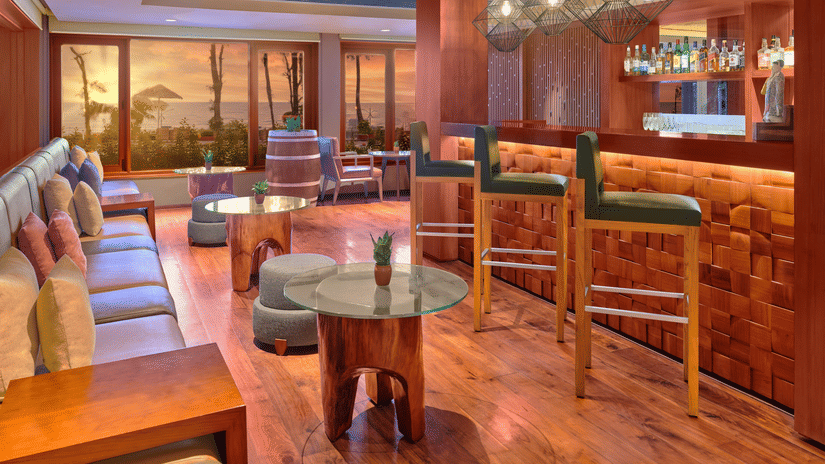 A seaside bar with comfortable seating and great ambience.