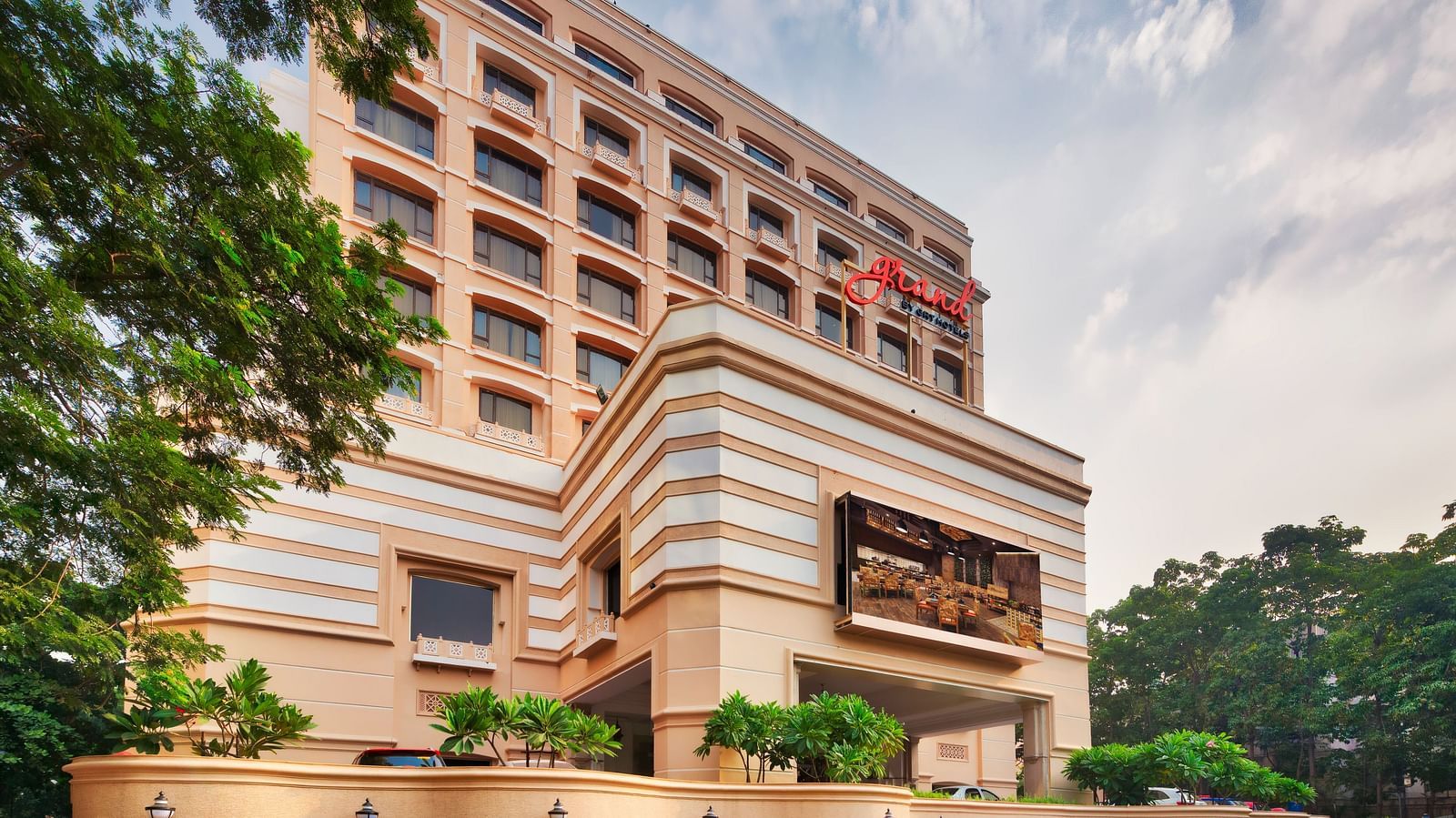 Side view of Grand Chennai By GRT Hotels during day time.