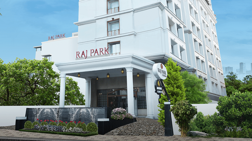 facade of Raj Park in the morning with blue sky in the background - Raj Park Hotel, Chennai