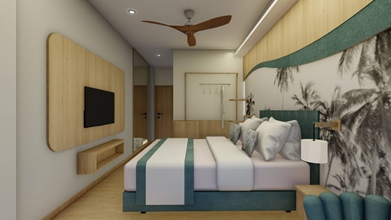 Deluxe Room with a wall-mounted smart TV facing the bed | Shirgaonkar Beach Resort