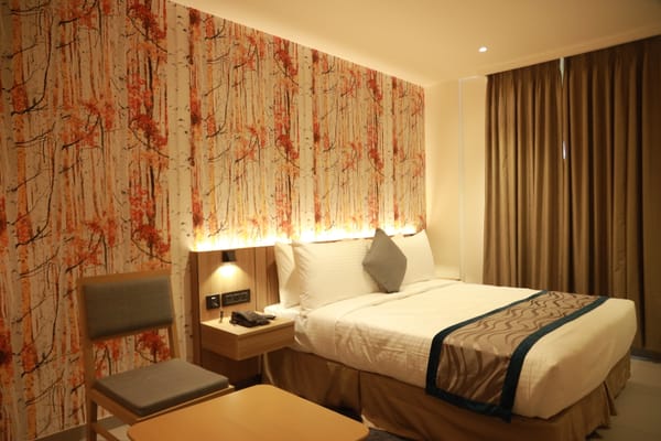 Spacious Deluxe room at City Lake Hotel, Bengaluru