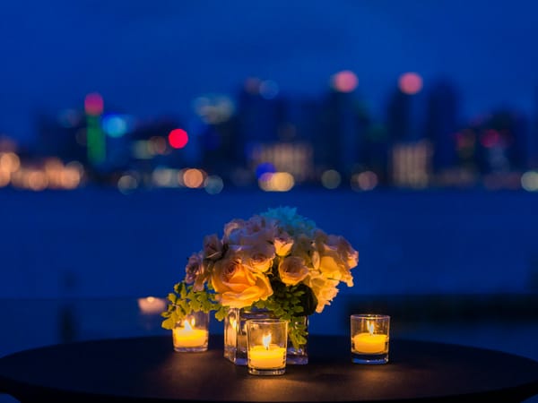Candle-light dinner table with flowers and candles at dusk, Da Bay Inn Port Blair
