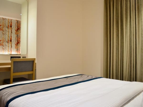 Standard double room interior at City Lake Hotel, Bengaluru
